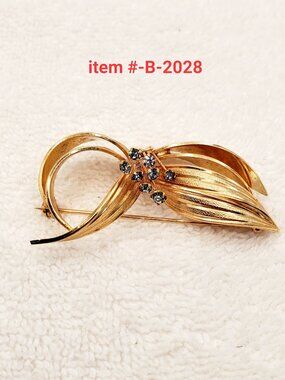 1 Brooch, item # B- 2028, wt. 18 grams.